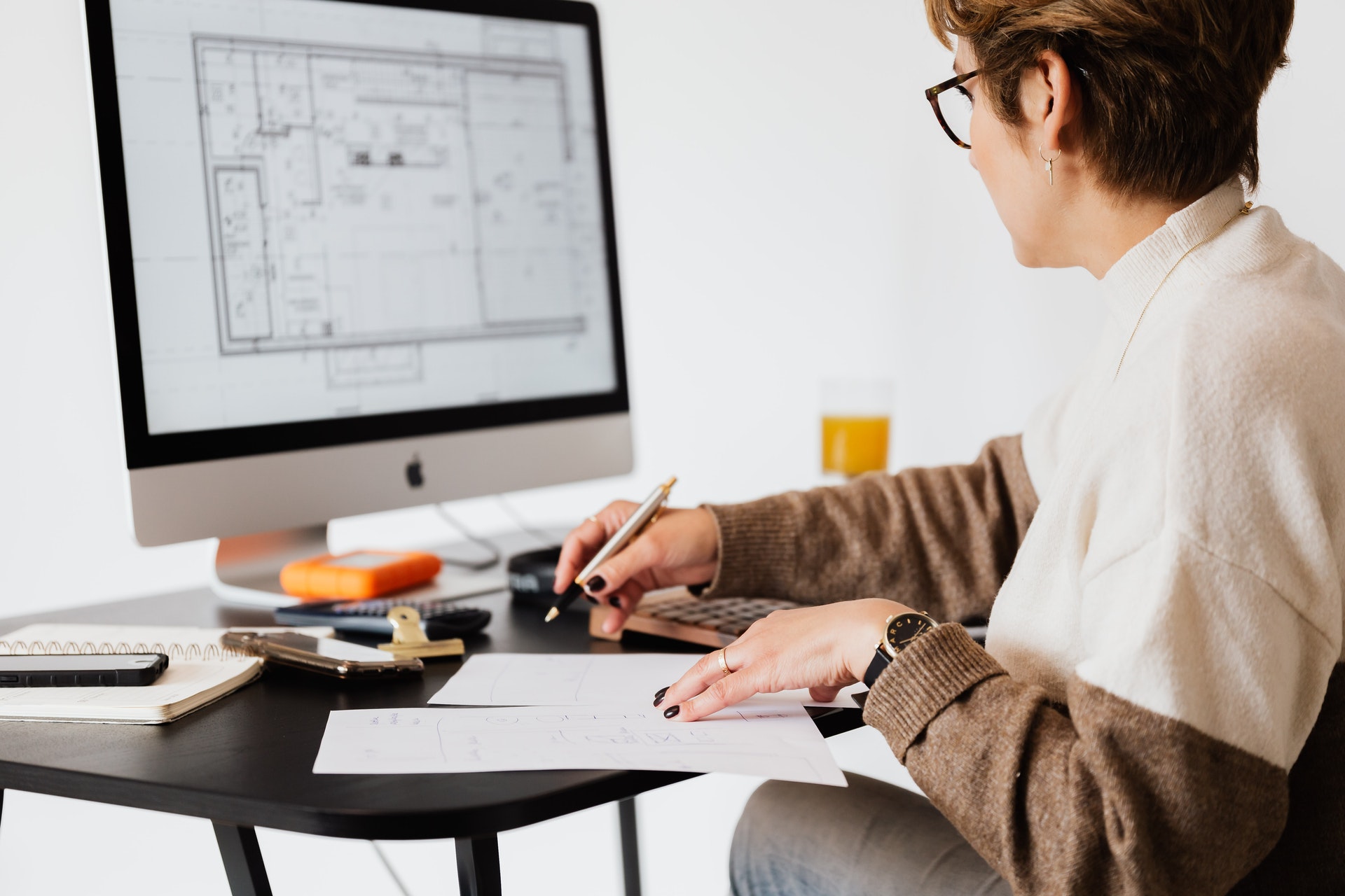 Person creating architectural drawings